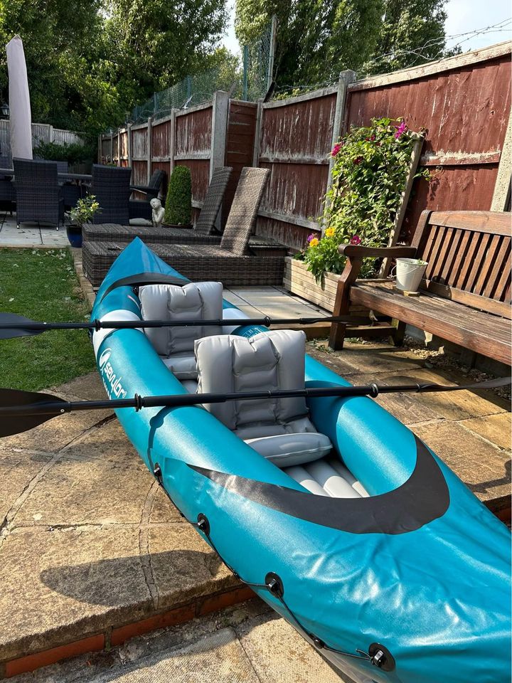 Inflatable double kayak with paddles