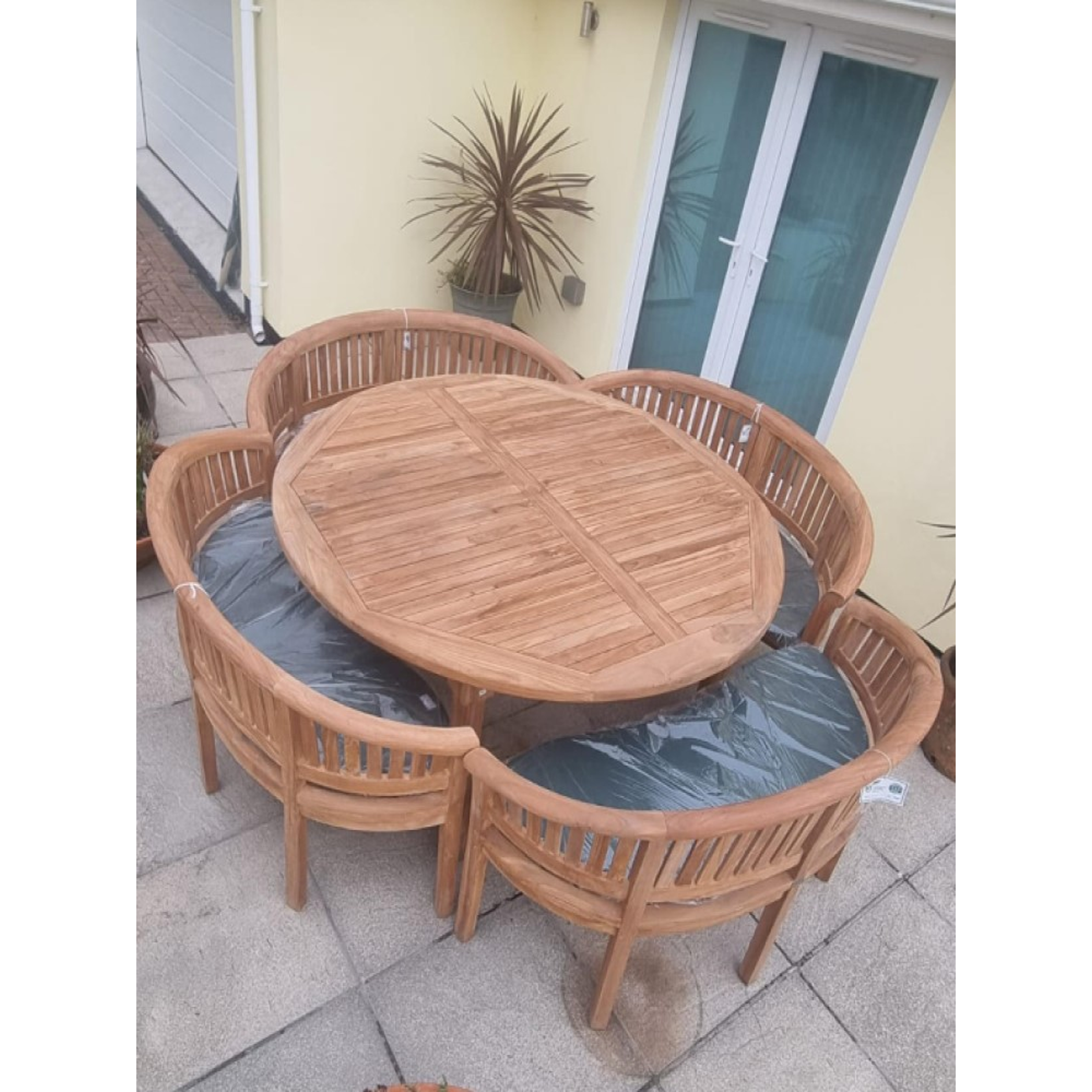 Teak garden dining set. 1.8m “Titan” round table, 4 bowwood style seats