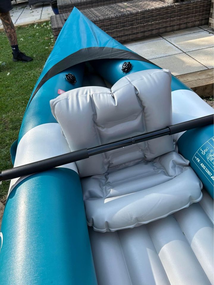 Inflatable double kayak with paddles
